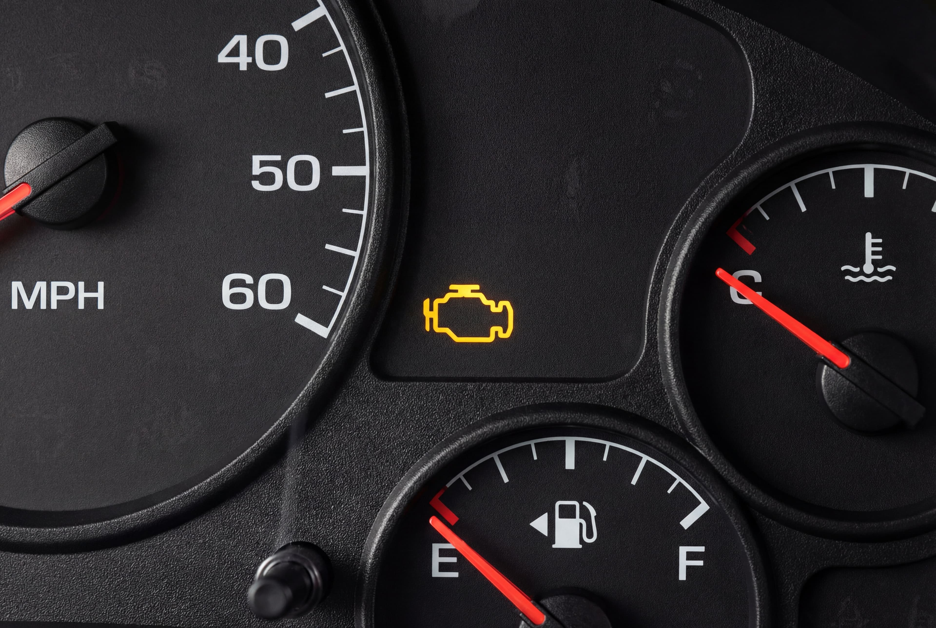 Check engine light on a dashboard